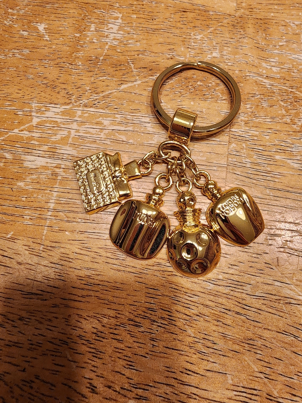 vintage Christian Dior gold-tone miniature perfume bottle charm keychain
